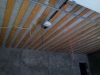 Оштукатуривание стен, утепление, пароизоляция и обрешетка потолка.